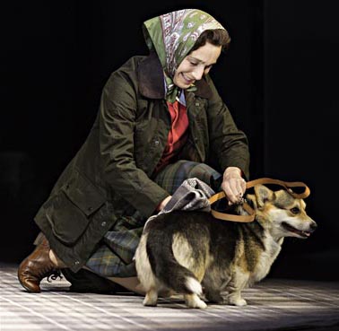The Queen with corgi on the stage